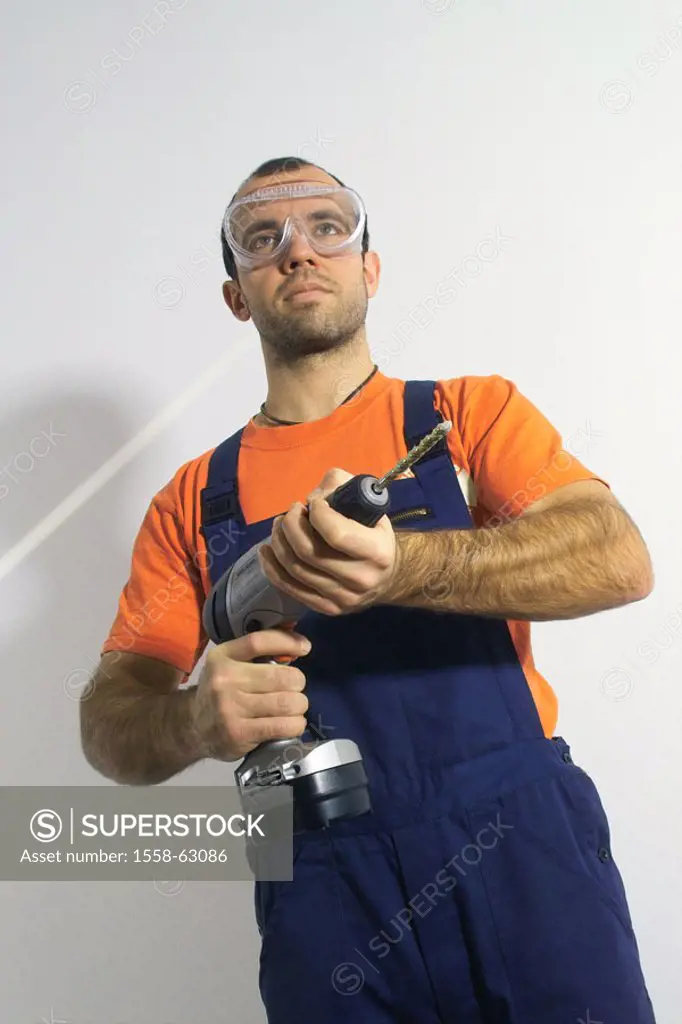 Do-it-yourself, man, goggles,  Drill  Do-it-yourselfers, 20-30 years, working clothes, protection, glasses, overalls, home works, renovation performan...