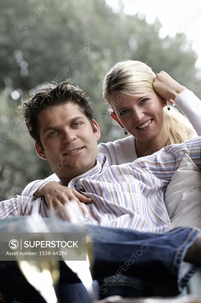 couple, young, basket chair, terrace,  Champagne glasses, relaxation, relaxen,  Togetherness  at home, cheerfully, smiling, 20-30 years, embrace, part...