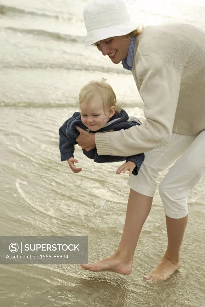 Sandy beach, mother, child, carries, nakedfoot,  Land on water shallow, playing, happy,  truncated Series, 20-30 years, 30-40 years, woman, child, dau...