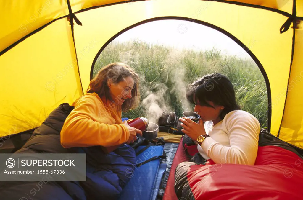 Women, tent, tea drink   20-30 years, two, sleeping bag, camps, camps, thermo mug, coffee, tea, hotly, drinks, sleeping, interior, yellow, background,...