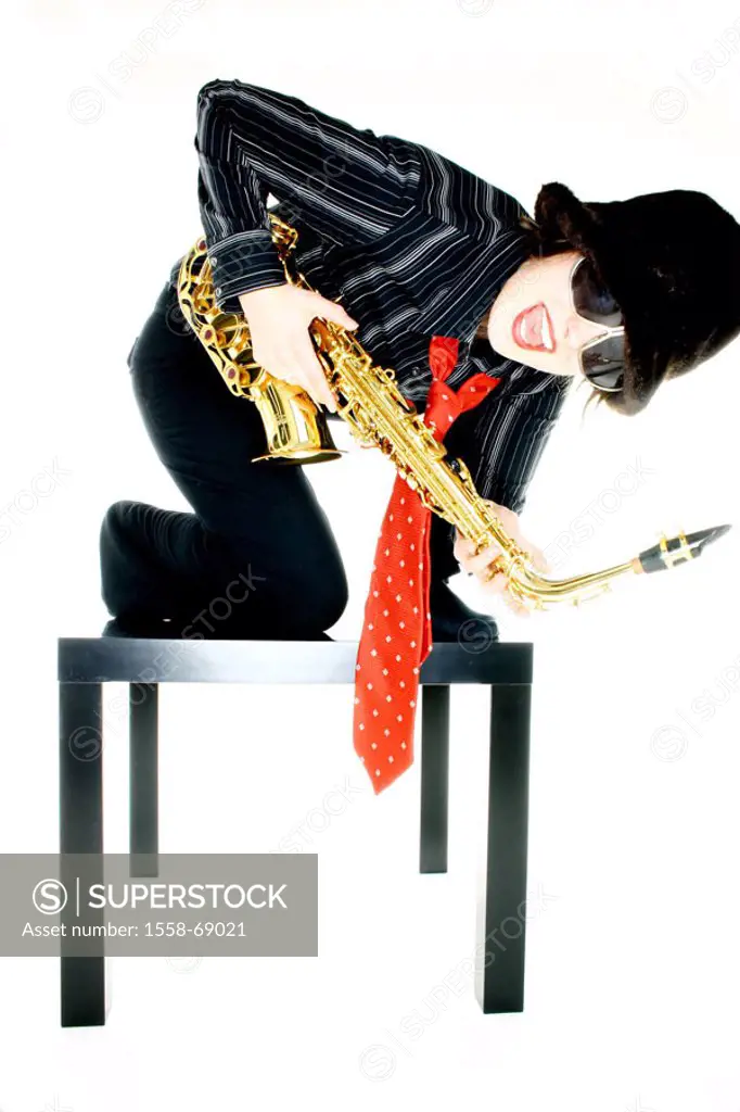 Woman, young, table, kneeling, saxophone playing   Series, truncated, 20-30 years, musician, brunette, sun glass, hat, fur cap, headgear, necktie, clo...