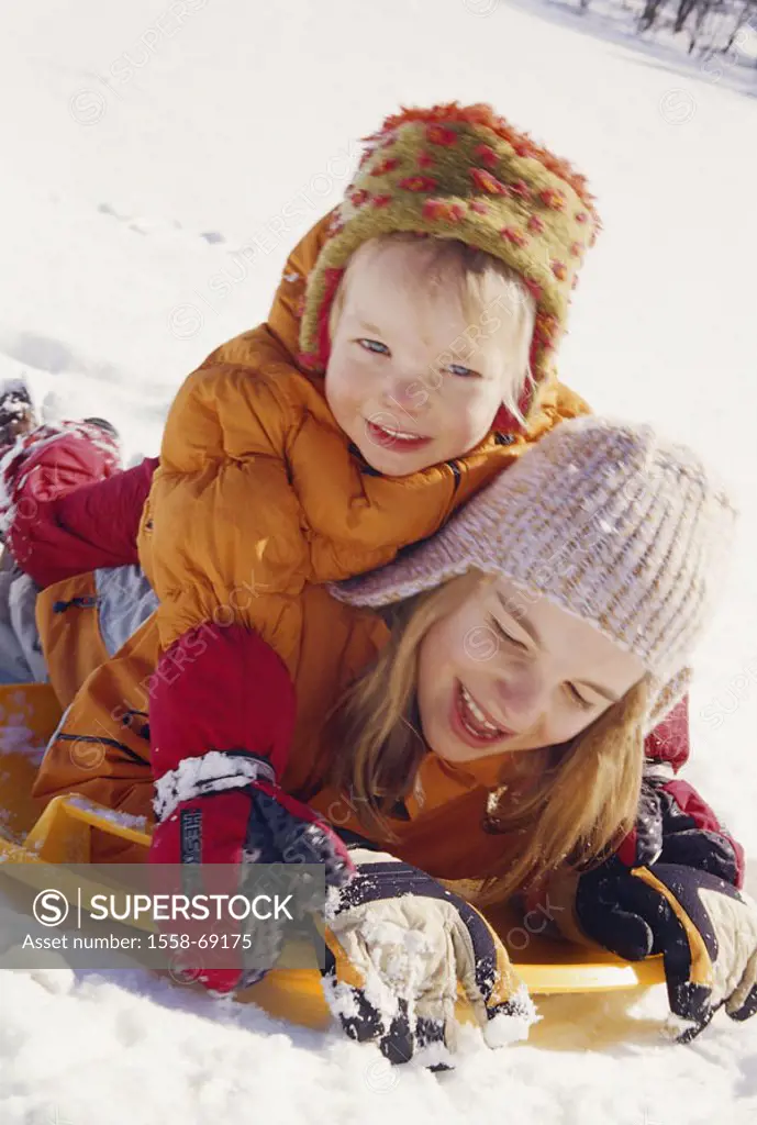 Children, cheerfully, lie, one on top of the other,  Plate Bob, snow, portrait  Child portrait, girls, sisters, two, 2-3 years, 6 years, childhood, se...