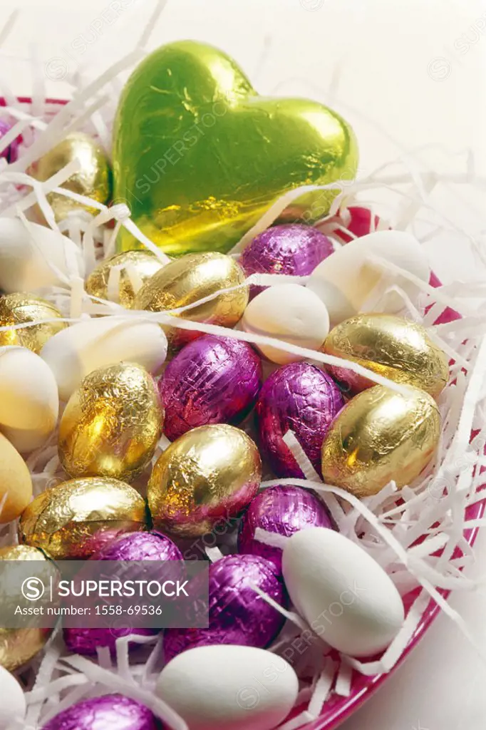 Easter, Osternest,  Chocolate Easter eggs, sugar coated tablet eggs,  Easter, Eastertime, chocolate, candies, sweet,  Candies, sweet, saccharated, tra...