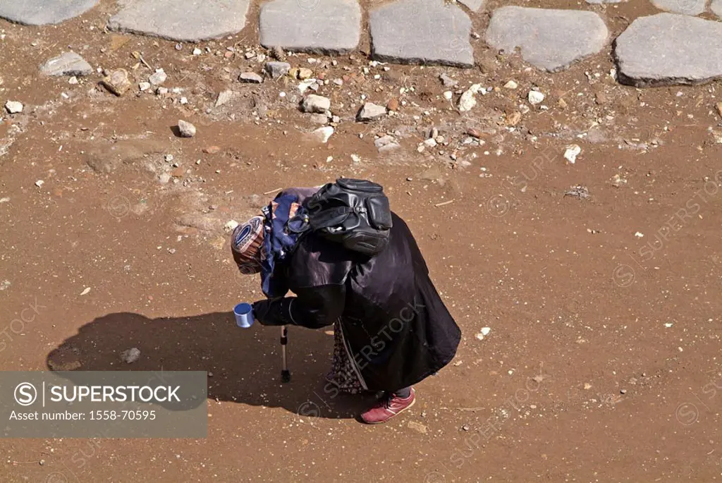 Beggar, bent down, from above  Woman, senior, homeless, stick, posture, rested weakly, weakened, backpack, cups beg, poverty, alms, support