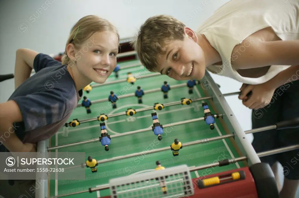 boy, girls, table football, play,  Look camera, laughing, detail  Series, children, siblings, 9-14 years, table soccer games, table soccer game, toget...