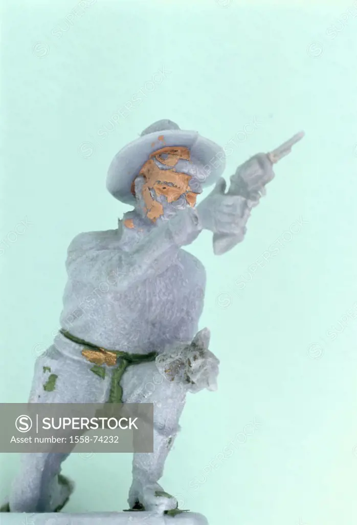 Toy figure, cowboy, color,  flaked off  Toy, figure, plastic figure, plastic figure, cowboy figure, man, pistol, revolvers, shoots, aims, cowboy hat, ...