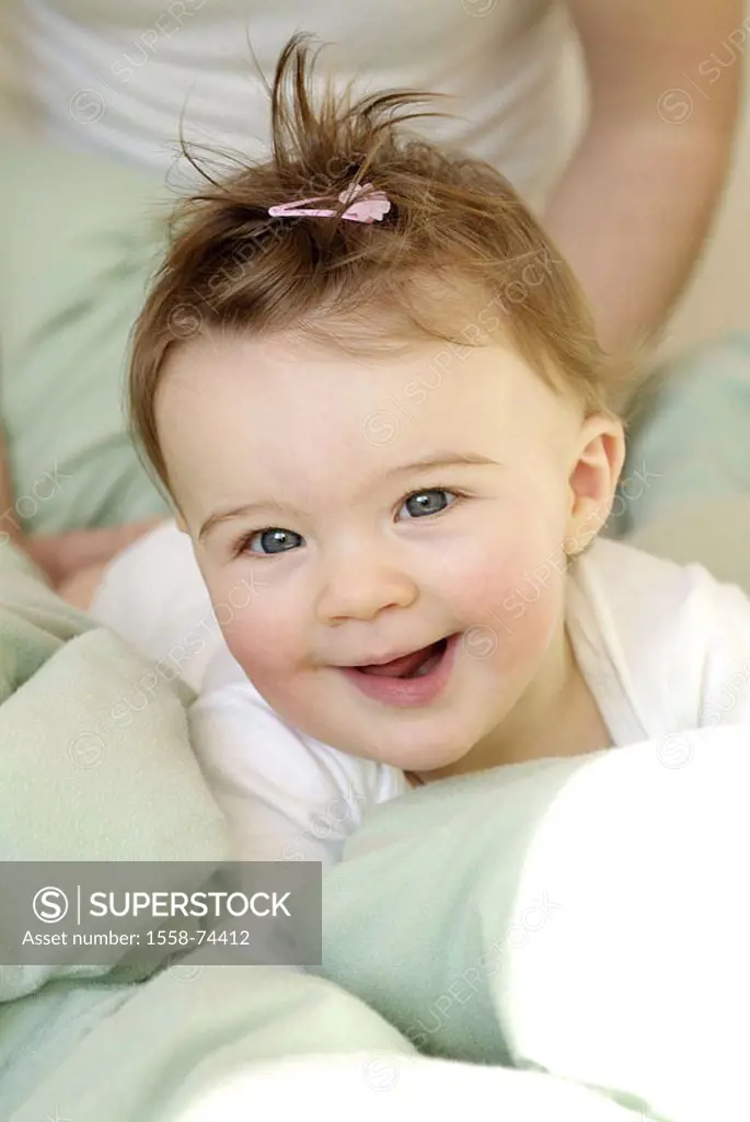 Bed, baby, cheerfully, smiling, portrait   Pillows, child, small, 6-12 months, girls, infant, eye color blue, barrette, playing, crawls, archly, cutel...