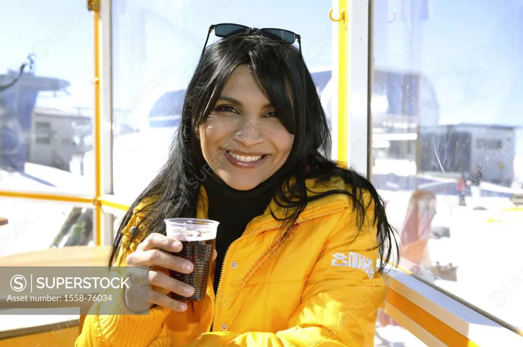 Mountain station, Restaurantterrasse,  Woman, young, cheerfully, beverage hotly, Portrait Gastronomy, ski hut, terrace, dark-haired, winter clothing, ...