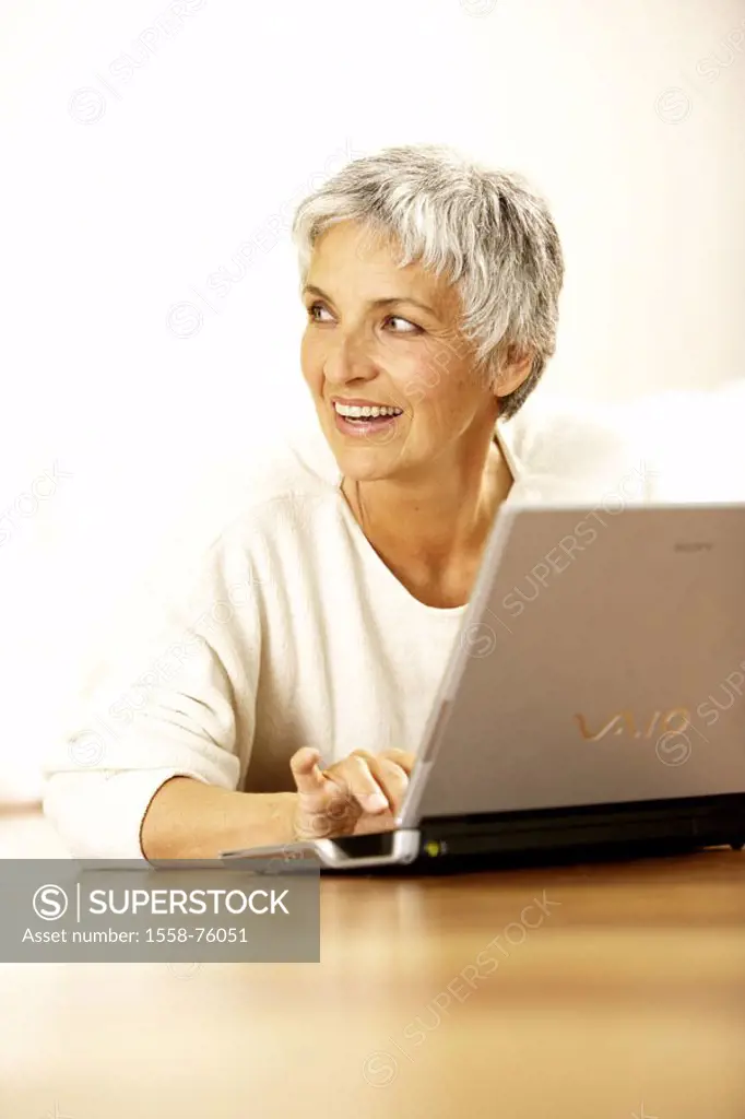 Senior, smiling, laptop, taps,  Portrait   Series, seniors, women portrait, woman, 60-70 years, well Age, well Agers, attractiveness short-haired shor...