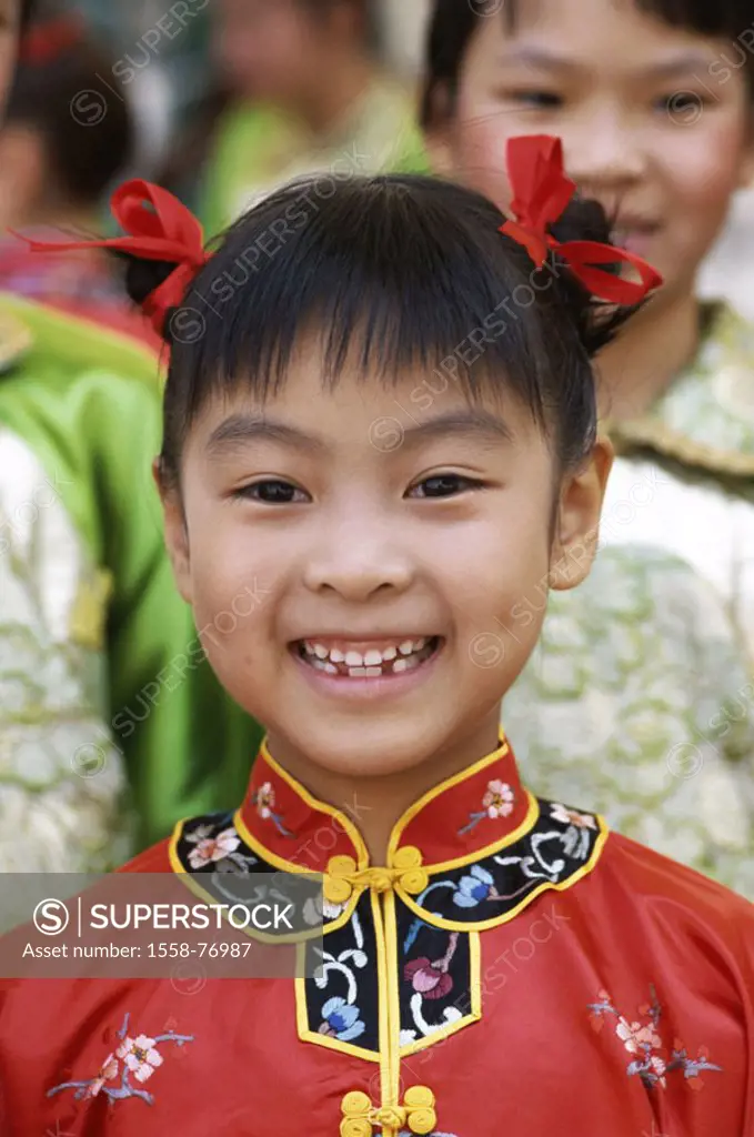 China, Peking, girls, Folklorekleidung, laughing, portrait  Asia, Eastern Asia, 8-12 years, child, dress ´Cheongsam´, red, gaze camera, cheerfully, ch...