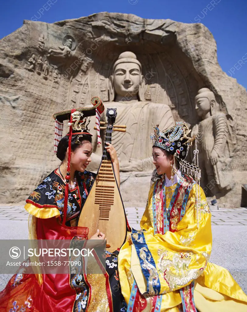China, Hong Kong, rock, Buddha-Skulpturen, Women, national traditional costume, tones, makes music  Native, Chinese, young, Folklorekleidung,  Clothin...