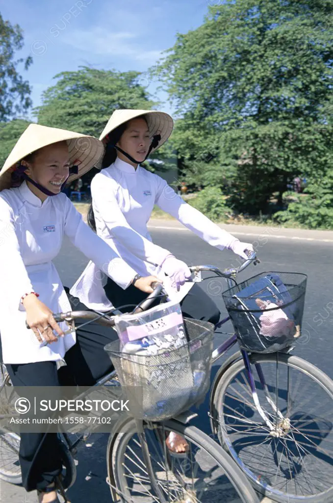 Vietnam, Mekong delta, Can Tho, Schoolgirls, straw hats, driving wheels Southeast Asia, natives, girls, students, Women, young, Vietnamese, two, cycli...