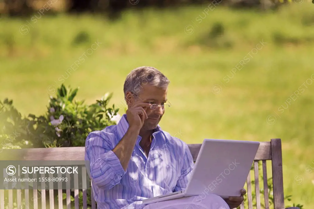 Garden bank, man, middle age, glasses,  sitting, laptop, reading  Series, 40-50 years, well Age, glasses bearers gesture grey-haired, short-haired, go...