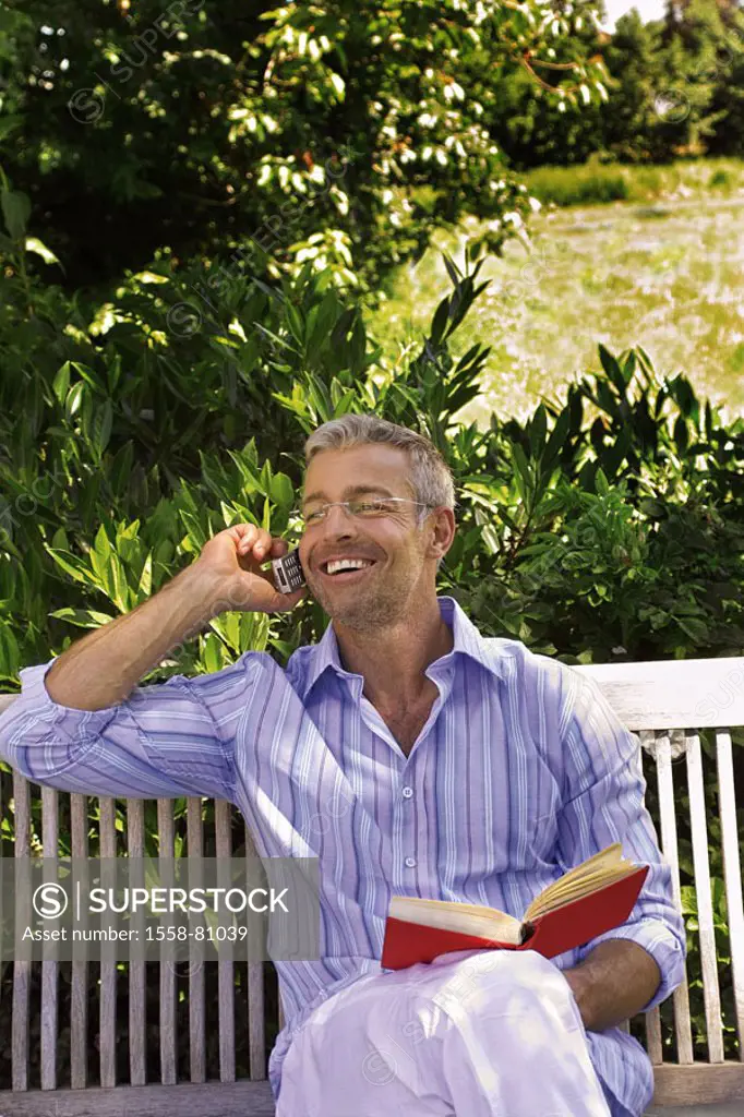 Garden bank, man, middle age, glasses,  sitting, cell phone, telephones, smiling,  Book, holding Series, 40-50 years, well Age, glasses bearers grey-h...