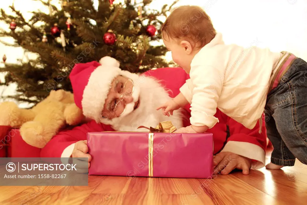 Santa Claus, gift, floor,  lie, baby, curious  Series, child, baby, 1-2 years, explores, discovers, experience, interest, learning process, developmen...