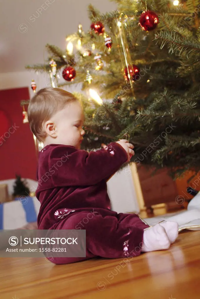 Toddler, sitting, on the side, Christbaum,  Christmas tree jewelry, playing   Series, Christmas, party, Christmas time, lights, shine, balls, Christma...
