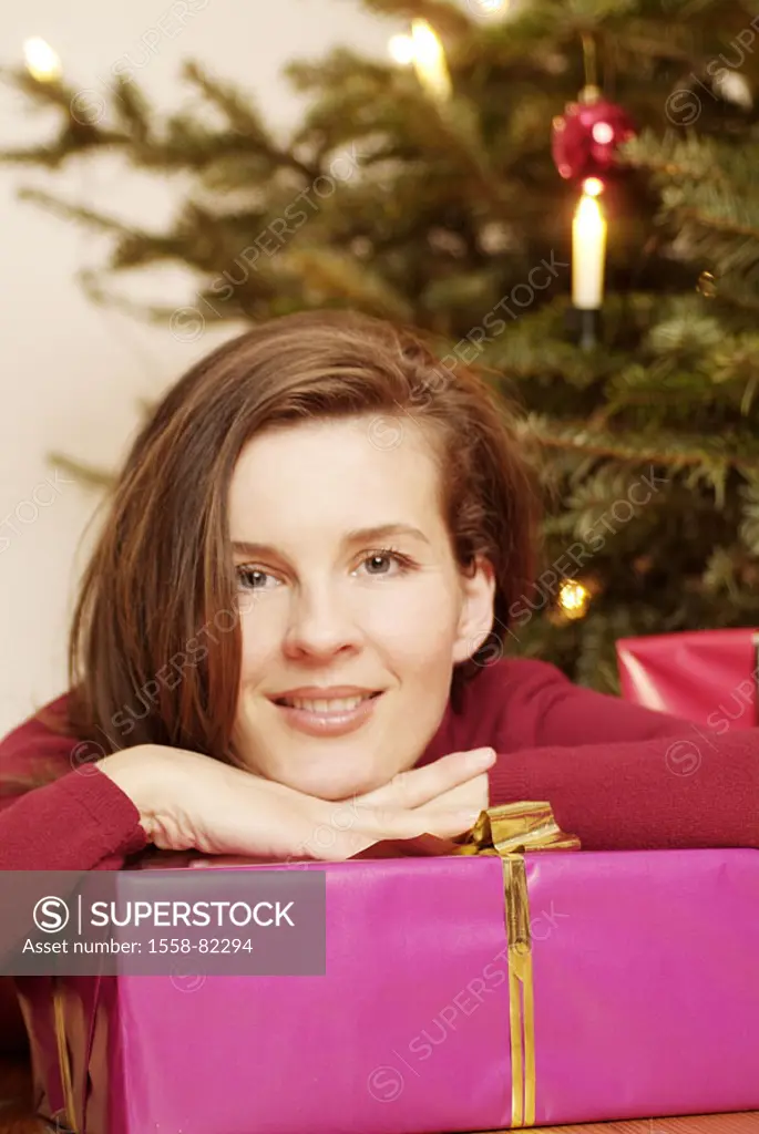 Woman, young, Christmas present, smiling,  Head, hang up, portrait  Series, Christmas, party, Christmas time, Christmas tree, gift, women portrait, br...