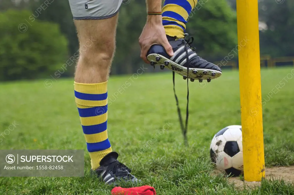 Soccer ground, man, detail, shoe,  moves out  Soccer players, players, 20-30 years, legs, stockings, stockings, yellow-blue, touched football shoe sho...