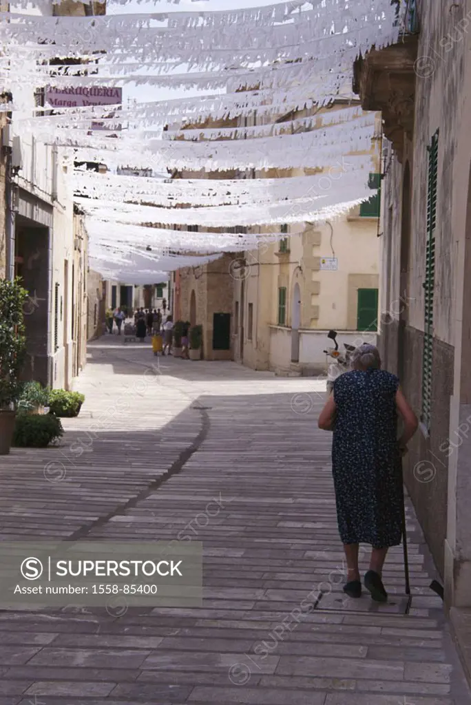 Spain, , island Majorca, Alcudia,  City center, garlands, senior,  view from behind,  Europe, Mediterranean island, city, alleys, streets, houses, bui...