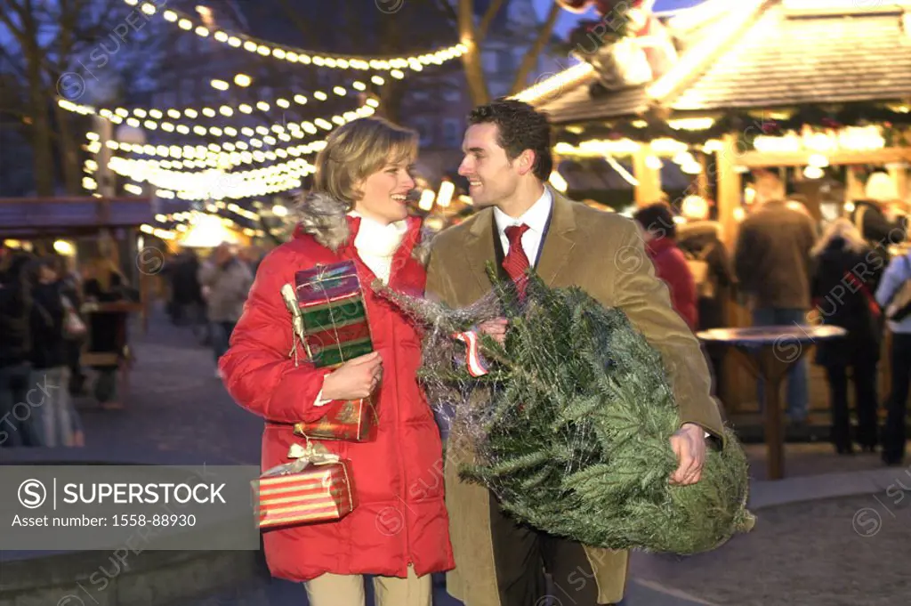 Christmas market, couple, Christmas purchases, Christmas tree, smiling, happy,  Evening,  Series, 30-40 years, partnership, friends, laughing,  fall i...