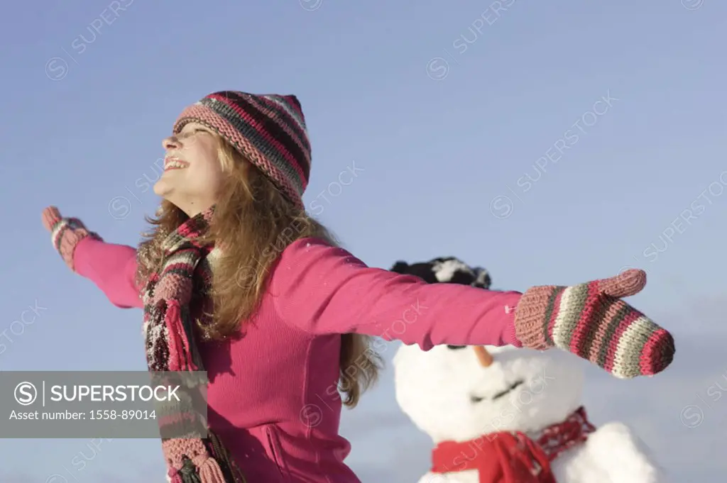 Woman, young, cheerfully, omitted, poor, extends, snowman, winters,   Series, 16-18 years, teenagers, teenagers, girls, rope cap, cap, headgear, glove...