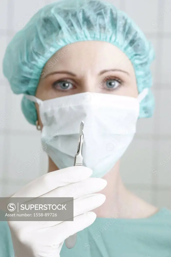 OP-Ärztin, shows seriously, scalpel,  Portrait,   Series, woman, 30-40 years, OP-Kleidung, mask, gaze camera surgeon OP-Schwester doctor beauty surgeo...