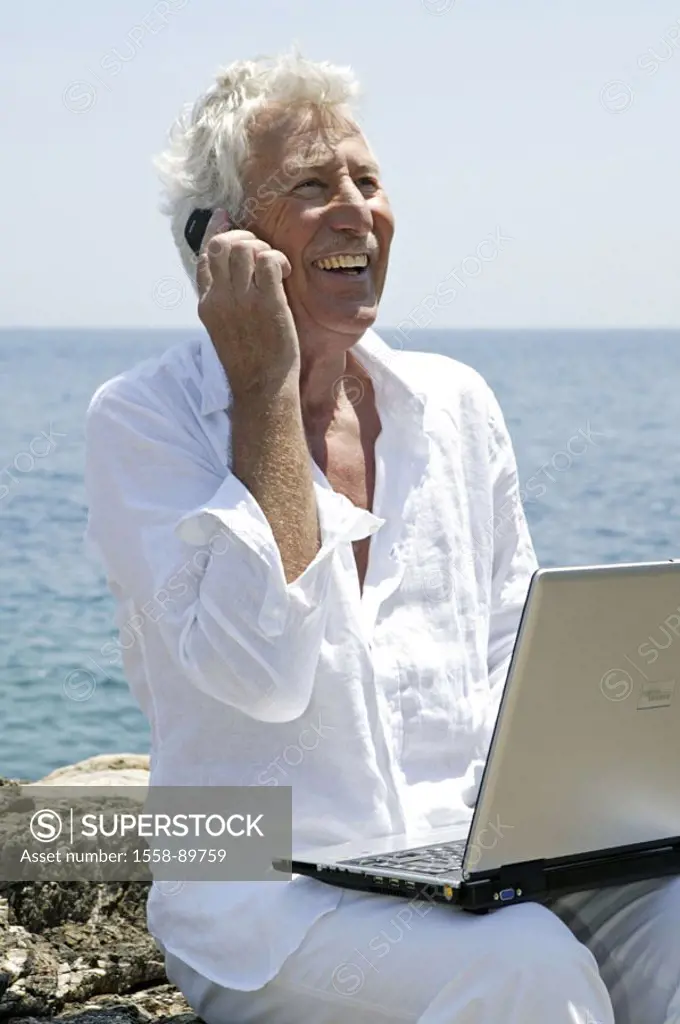 Sea, rock coast, senior, laptop,  Cell phone, telephones, happy,   Series, 50-60 years, seniors, man, white-haired, clothing white that computers, wel...