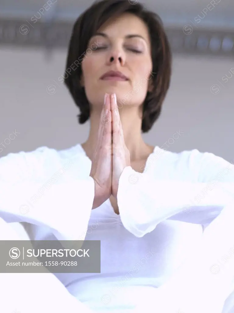 Woman, sitting, hands folded,  Concentration, truncated, from below,   30-40 years, eyes, brown-haired, closed clothing, meditation, Yoga white, Yogaü...