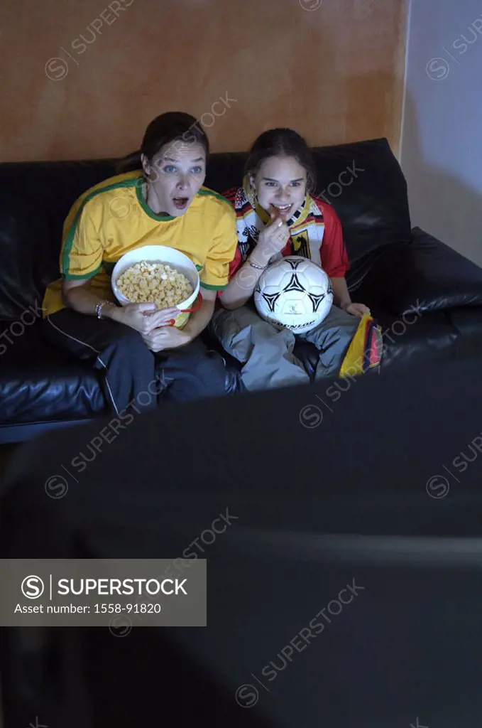 Mother, daughter, living rooms, television,  Football fans, tension, concentration,  worries, observing,  Series, parent, woman, child, girls, popcorn...