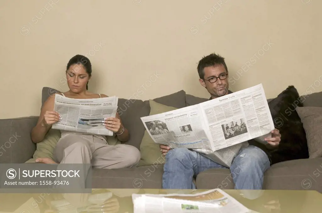 Living space, couple, sofa, sitting,  Newspaper, reading,   Series, partnership, relationship, relaxation, relaxen,  Daily newspaper, newspaper readin...