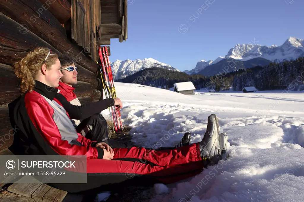 Cottage, couple, young, sitting, pause, outlook,  enjoying, cross-country skier, sticks, leans,   Series, long runners, winter athletes, athletes, ath...