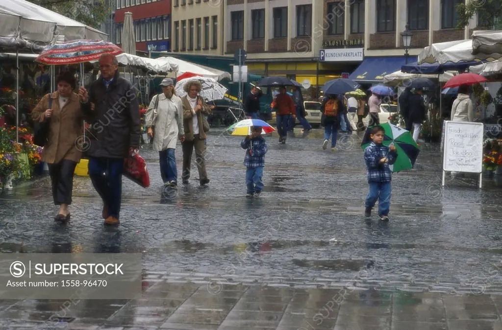 Germany, Upper Bavaria, Munich,  Viktualienmarkt, passer-bys, rain,   Bavaria, market, week market, market stand, pedestrians, umbrellas, rainy weathe...