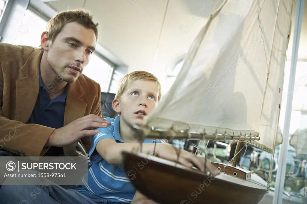Father, son, Modell-Segelboot, views,   Man, 20-30 years, child, 6-9 years, model construction, sailboat, sail ship, model sail ship, looks at, shows,...
