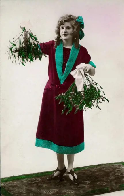 Postcard, historic, woman is holding sprigs of mistletoe,