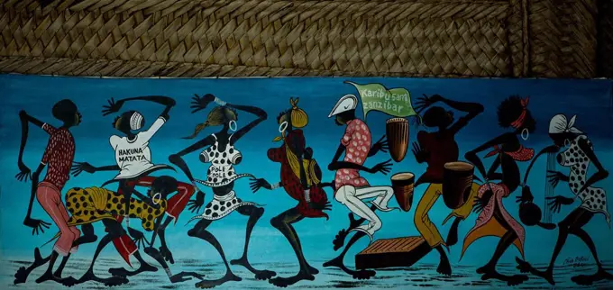 A piece of art with dancing people was offered to us in a souvenir shop on Zanzibar.