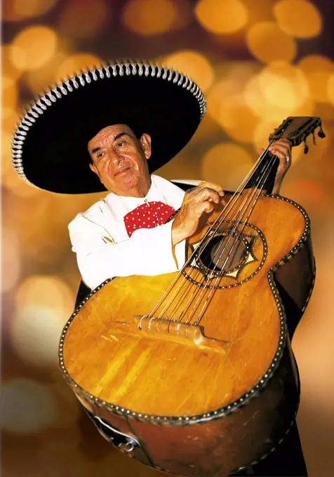 Mexican plays the guitar