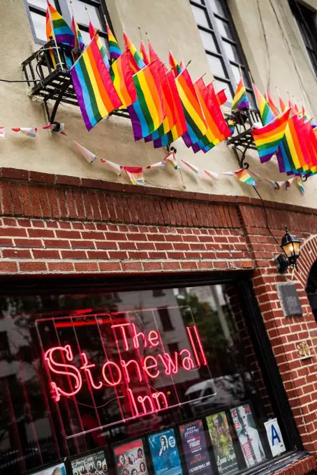 USA, New York, New York City, Lower Manhattan, Greenwich Village, rainbow flags outside of The Stonewall Inn, birthplace of US gay liberation
