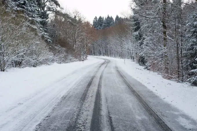 Snowy country road in winter, Wagenschwend, Odenwald, Baden-Wurttemberg, Germany