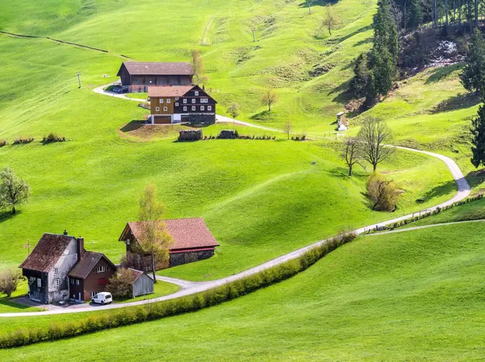 Prealpine hill landscape with farmhouses in Central Switzerland
