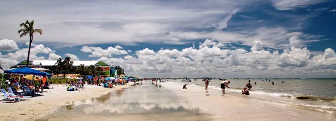 The USA, Florida, fort Meyers, people on the beach, clouds