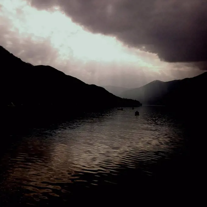 Dramatic light above the dark lake