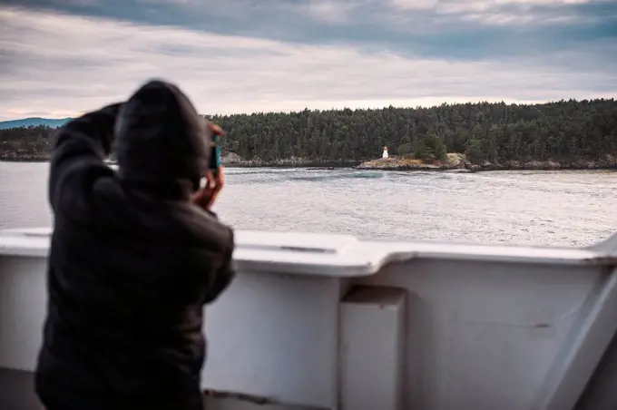 Ferry trip to Vancouver Island, man photographing, British Columbia, Canada