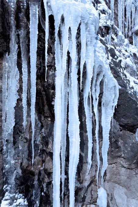 Icicles on a steep rock face