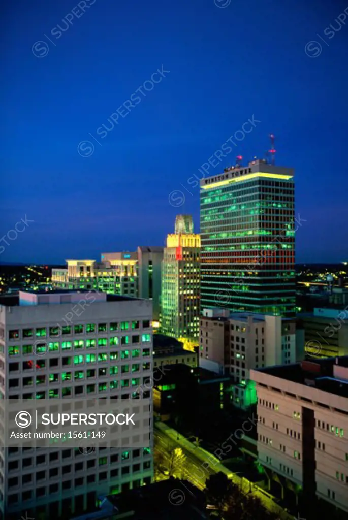 High angle view of buildings lit up at dusk, Winston-Salem, North Carolina, USA