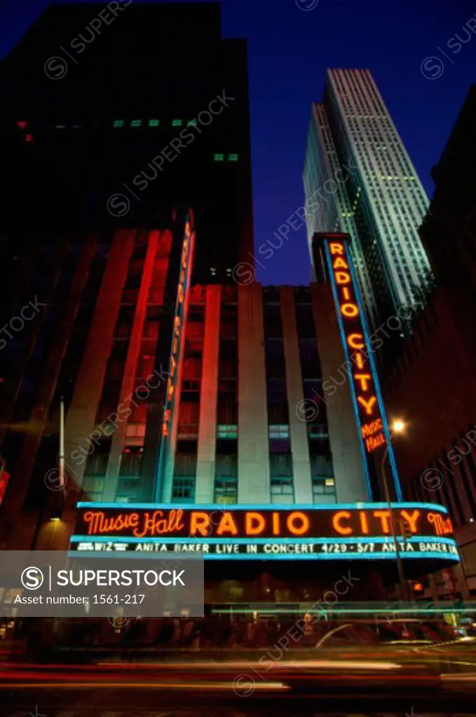 Low angle view of buildings lit up at night, Radio City Music Hall, Rockefeller Center, New York City, New York, USA