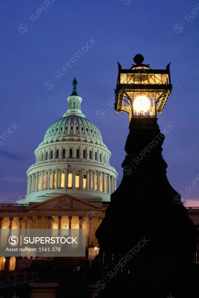 Low angle view of a government building lit up at dusk, Capitol Building, Washington DC, USA