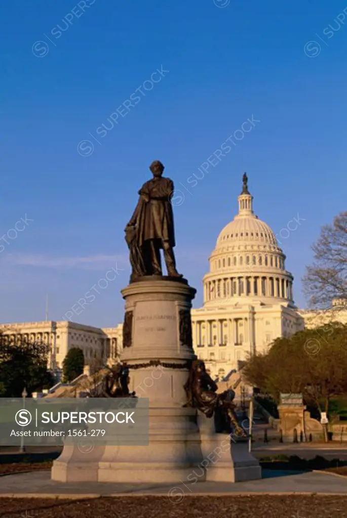 Low angle view of a statue in front of a government building, James A. Garfield Statue, Capitol Building, Washington DC, USA
