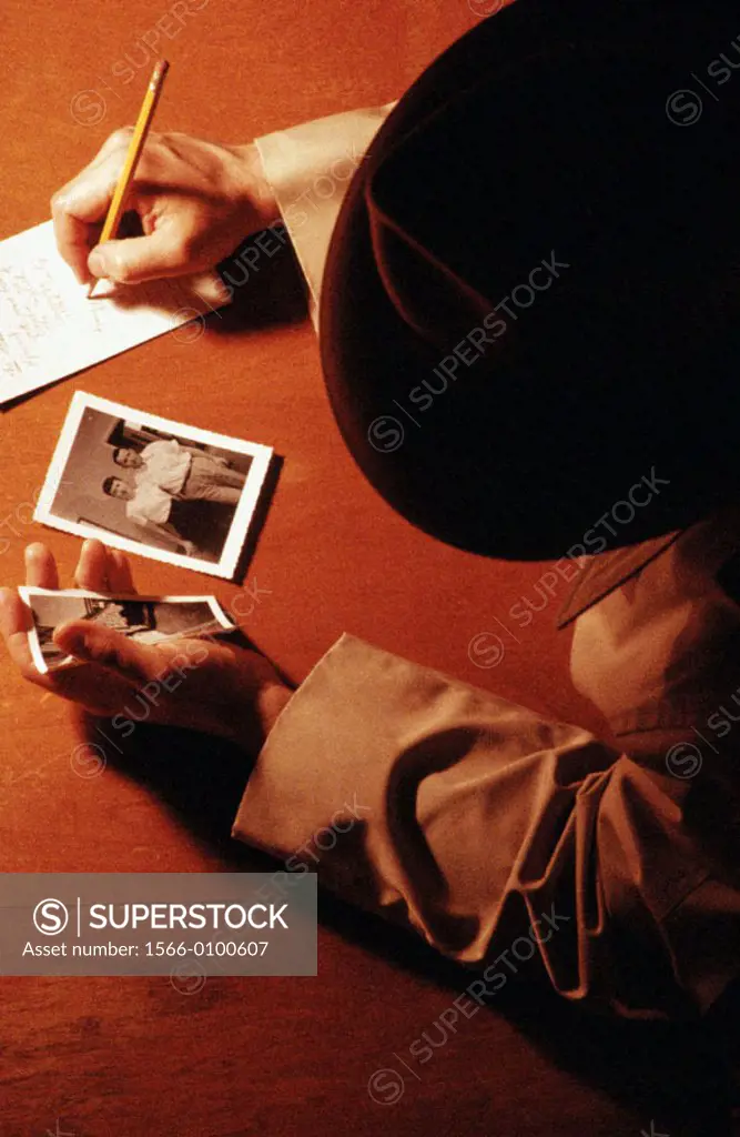 Detective looking at photographs
