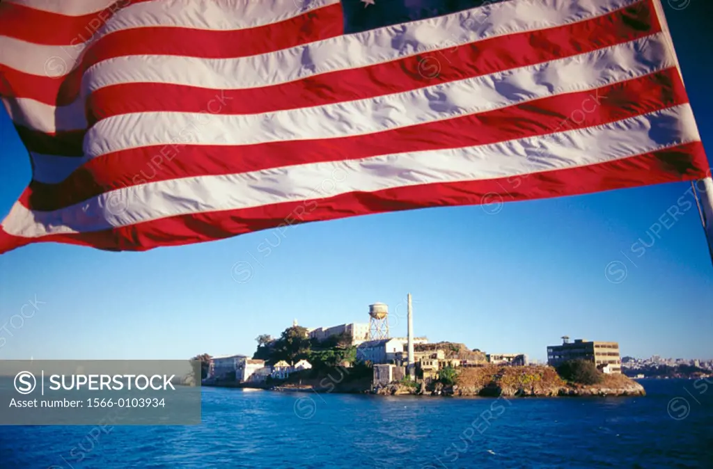 American flag and Alcatraz Island in background. San Francisco. California. USA