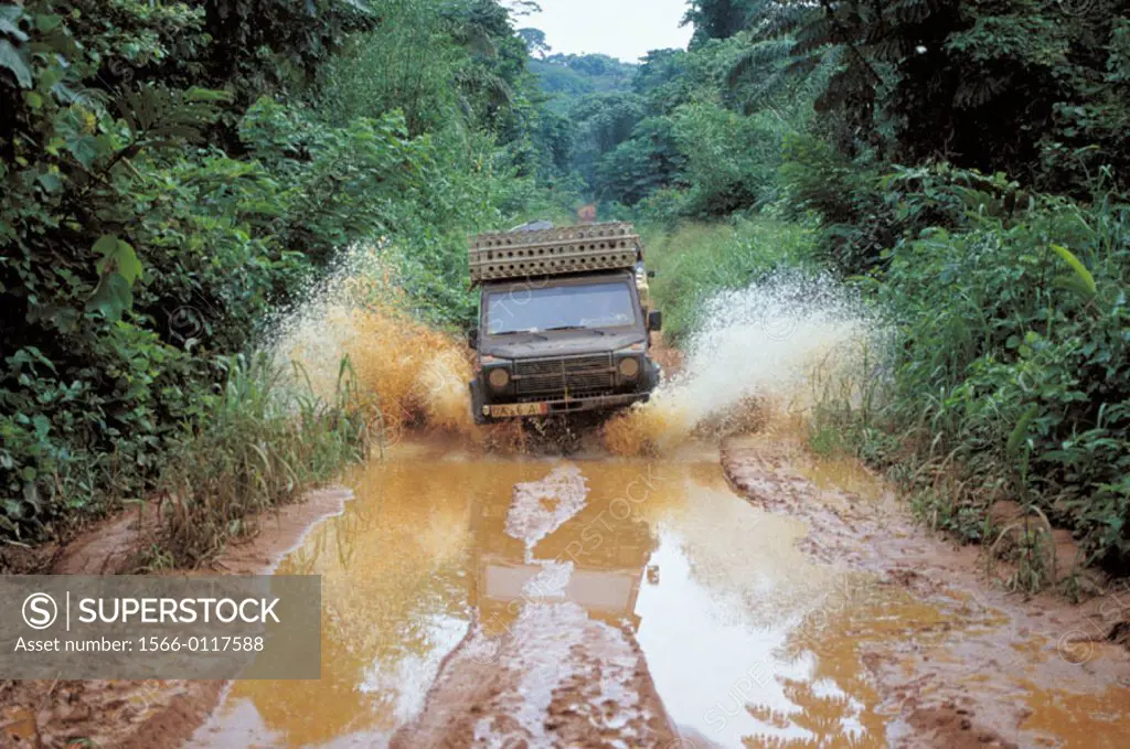 Car going through a mud hole. Democratic Republic of the Congo (former Zaire)